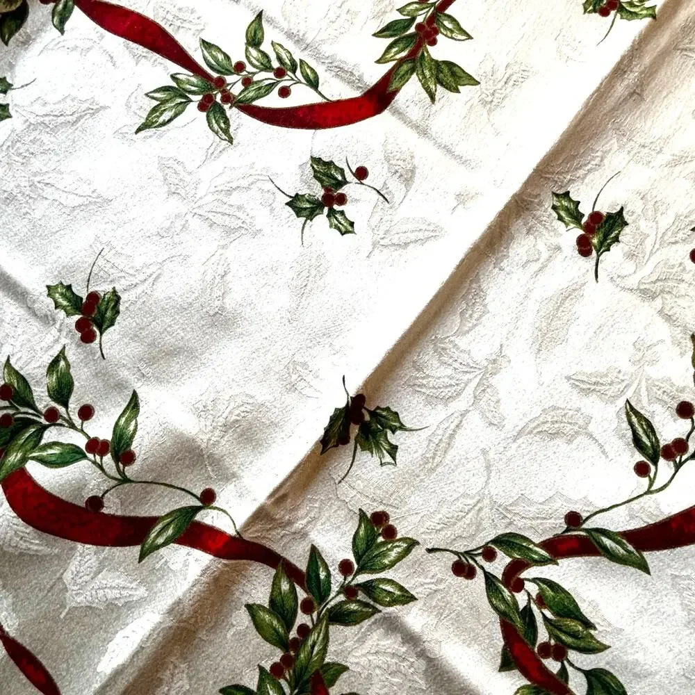 Vintage Christmas tablecloth creamy white brocade red green ribbon holly design